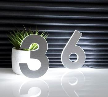 The N-Lux™ LED Floating Numbers are available in a sophisticated range of brushed metallic finishes, including silver, gold, bronze, copper, and black.