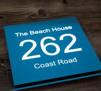 Striking blue sign with white illumination, our bespoke LED house signs have all the options to reflect your unique style. Our state-of-the-art manufacturing process ensures that your personalised sign is crafted to the highest standards, ready to adorn your home with elegance.
