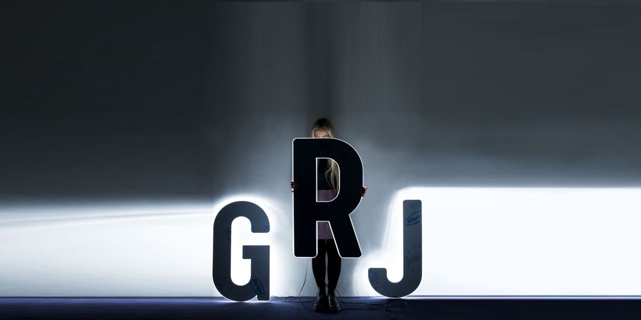 Marie hiding behind large LED numbers