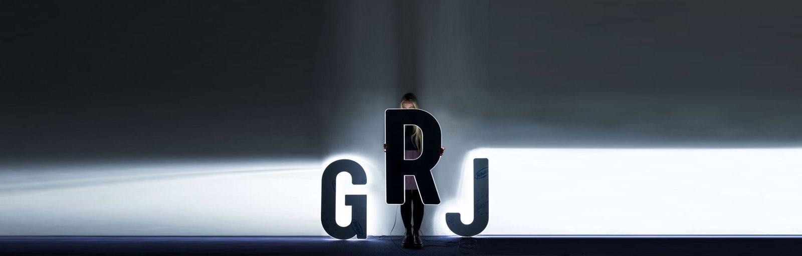 Marie hiding behind large LED numbers